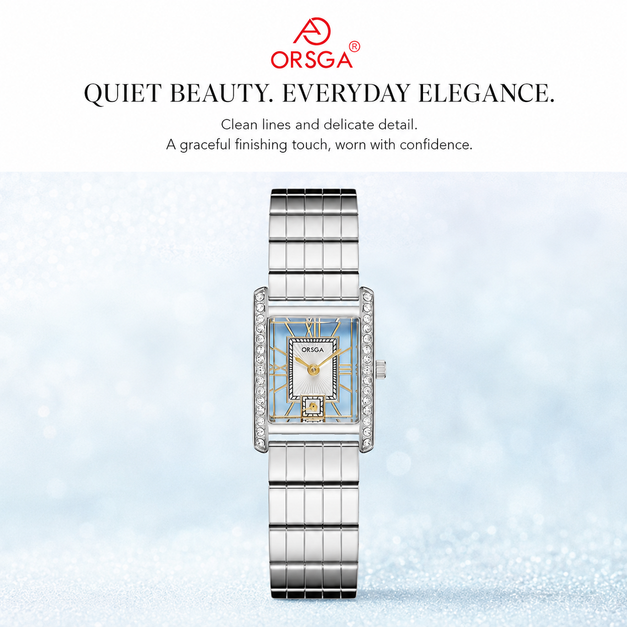 An ORSGA women's watch with a silver stainless steel link bracelet, a bezel set with small clear crystals, and a light blue dial with gold-tone hands and markers. The watch is presented on a light blue textured background with promotional text above it.
